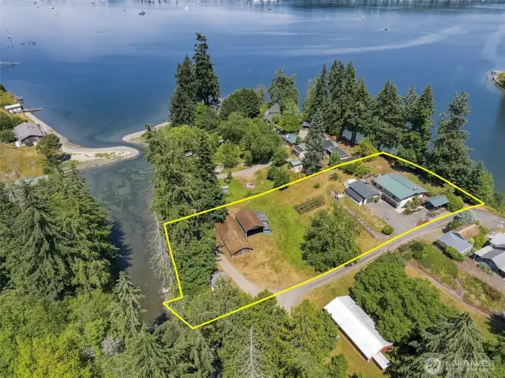 A private, tree-lined road leads to a 1.16-acre ribbon of land shaped by two very different waters. 145ft saltwater to the west and approximately 85ft low bank estuary to the east. A private, tree-lined road leads to a 1.16-acre ribbon of land shaped by two very different waters. 145ft saltwater to the west and approximately 85ft low bank estuary to the east.