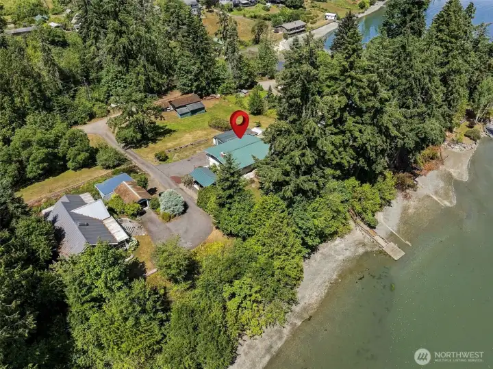 145 feet of medium-bank saltwater opens to the bay with stairs to the beach and floating dock. 145 feet of medium-bank saltwater opens to the bay with stairs to the beach and floating dock.