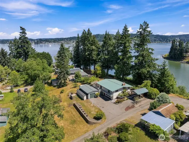 Rare peninsula-like setting, with mature landscaping, an heirloom orchard, and waterfront along two sides. Rare peninsula-like setting, with mature landscaping, an heirloom orchard, and waterfront along two sides.