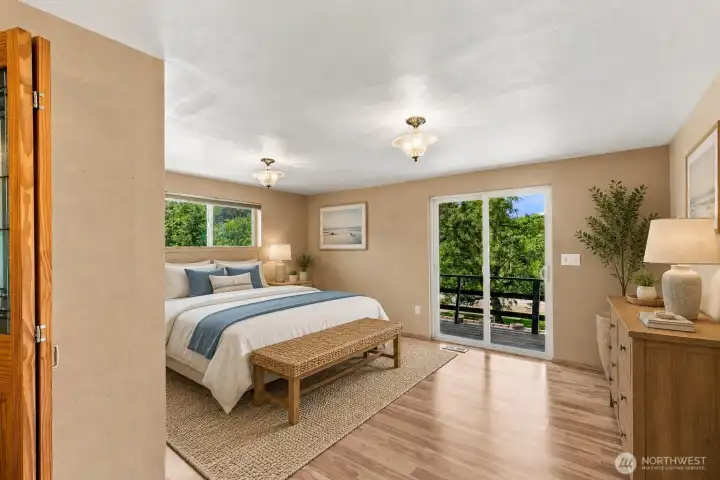 Spacious primary bedroom with walk-in closet and balcony access looking over the property. (Virtually Staged) Spacious primary bedroom with walk-in closet and balcony access looking over the property. (Virtually Staged)