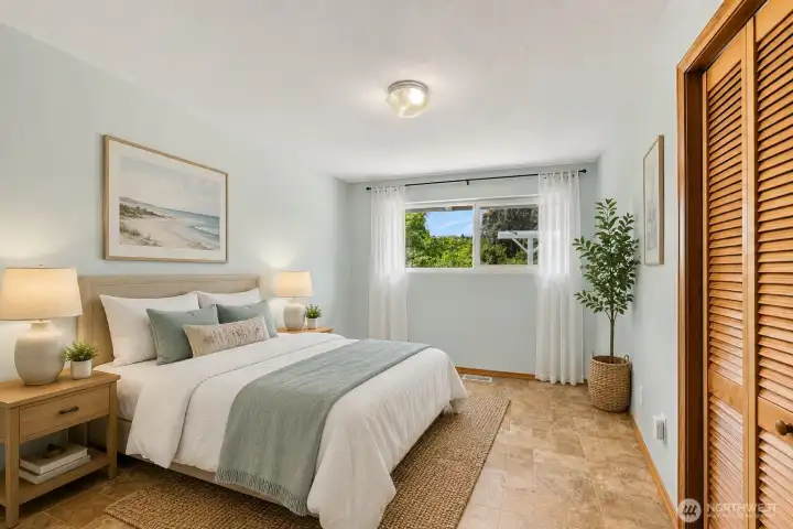 Comfortable secondary bedroom with a generous closet (with dumbwaiter). (Virtually Staged) Comfortable secondary bedroom with a generous closet (with dumbwaiter). (Virtually Staged)