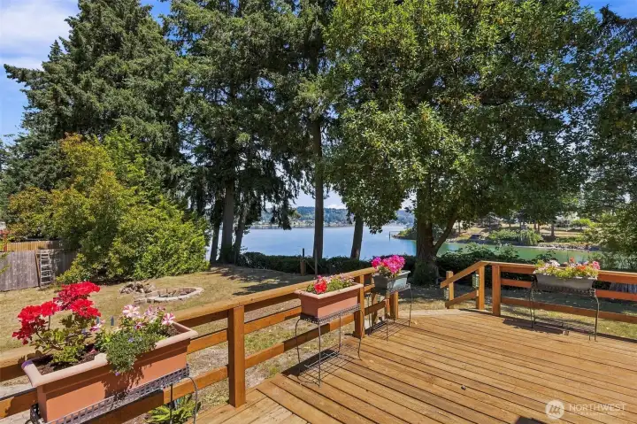 Spacious wrap around deck. Plumbed for in-deck hot tub (not pictured) and overlooking the north garden, concrete pond, and bay views. Spacious wrap around deck. Plumbed for in-deck hot tub (not pictured) and overlooking the north garden, concrete pond, and bay views.