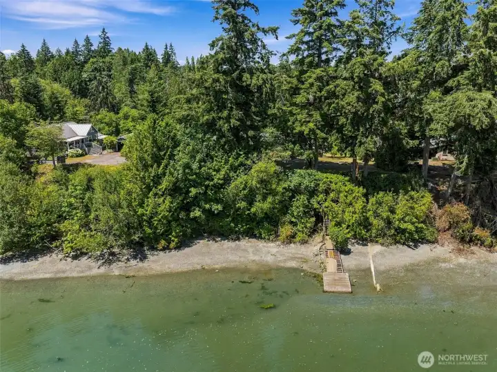 145ft waterfront with floating dock to launch canoes and kayaks. The beach is rocky/sand. Photos taken almost at high-tide. 145ft waterfront with floating dock to launch canoes and kayaks. The beach is rocky/sand. Photos taken almost at high-tide.