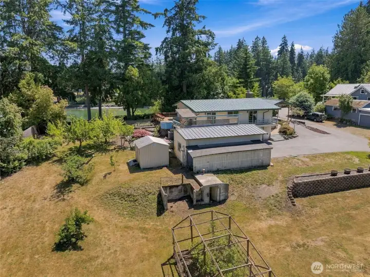 The property’s history appears throughout the grounds. An intriguing early concrete outbuilding is believed to have served as a farm smokehouse. The property’s history appears throughout the grounds. An intriguing early concrete outbuilding is believed to have served as a farm smokehouse.