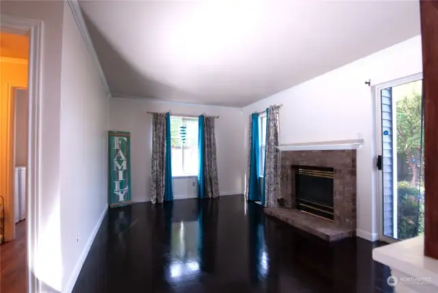 Lower level with Gorgeous Wood floors, Gas fireplace, Half bath, and Laundry room.