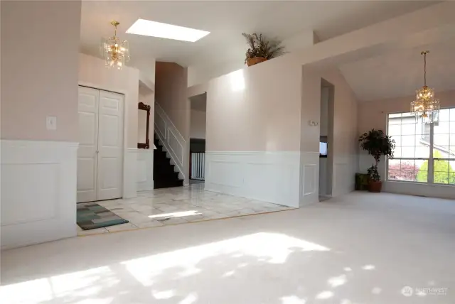 This home Welcomes you with Marble Flooring, Vaulted Ceilings, White Chair railing, and all the Natural Light that spills into the Formal living room and Dining room.