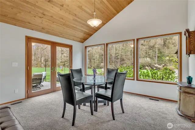 River view dining with french doors leading to paver patio.