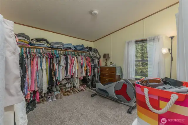 Bedroom number three has been converted into the best walk in closet ever.