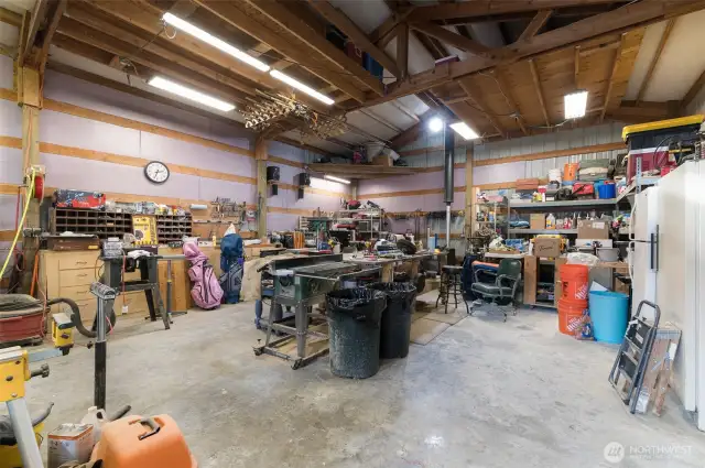 The shop has a pellet stove, loft and 220V power outlets.