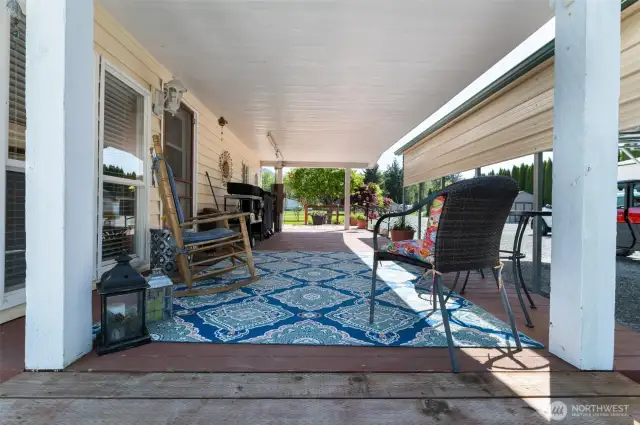 View of the comfy covered porch looking through to the front yard.