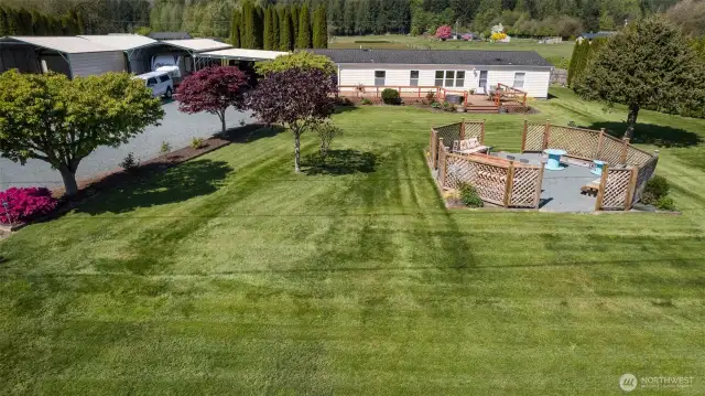 This home is nestled on one full level acre.