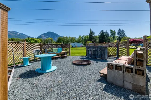 A newly built bar with tractor seat barstools and stylish seating will be perfect for unforgettable gatherings and summer BBQs.