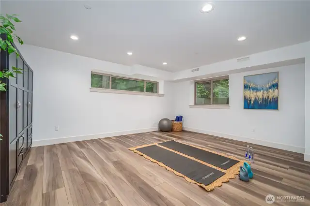 downstair unit's large bonus room, perfect for a large home office or start up hub