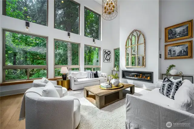two story living room overlooking the creek. Feels like you are living in your own enchanted forrest, but just 3 minutes drive to your morning coffee at Starbucks