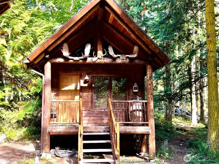 Sweet bunkhouse for your overnight guests. Includes a bedroom, half bath and loft