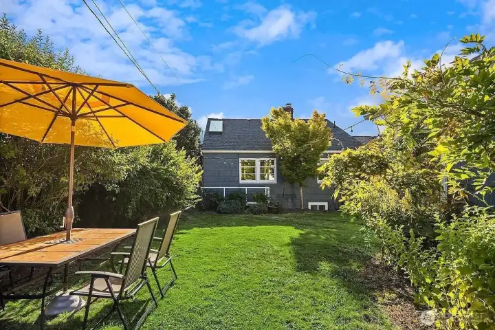 Fenced backyard oasis perfect for relaxing or entertaining.