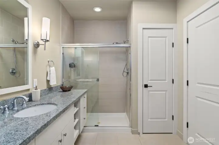 Dual vanity spa-esque upper floor 3/4 bathroom.