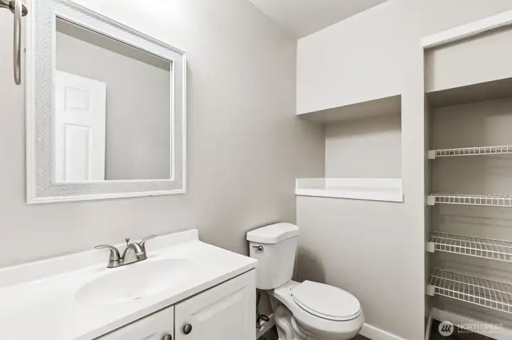 The downstairs half bath adds extra convenience for the guests.