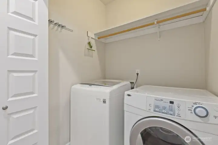 The designated laundry space is on the main level, tucked into a deep closet between Bedroom 3 and the main-level full bathroom.
