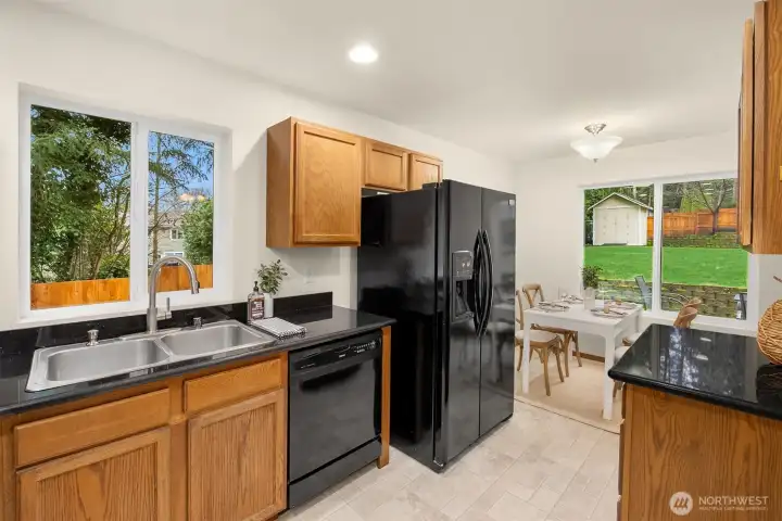 A nice mix of warm wood and back accents. Lots of counterspace!