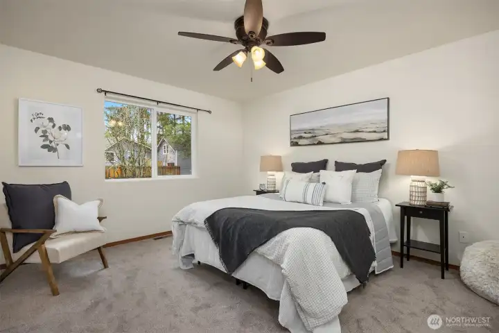 Now upstairs, exceptional primary suite overlooking the green backyard.