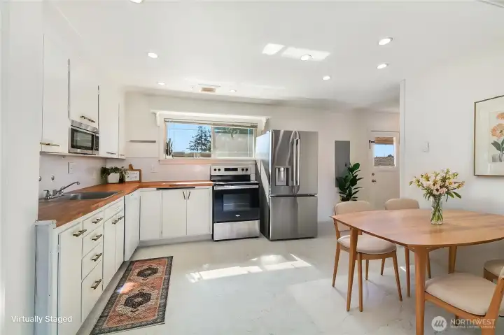 Light and bright kitchen with window overlooking the backyard.