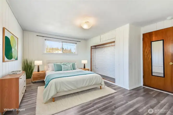 Primary bedroom with closet and attached 3/4 bathroom.