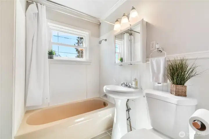 Full bathroom near two additional bedrooms.