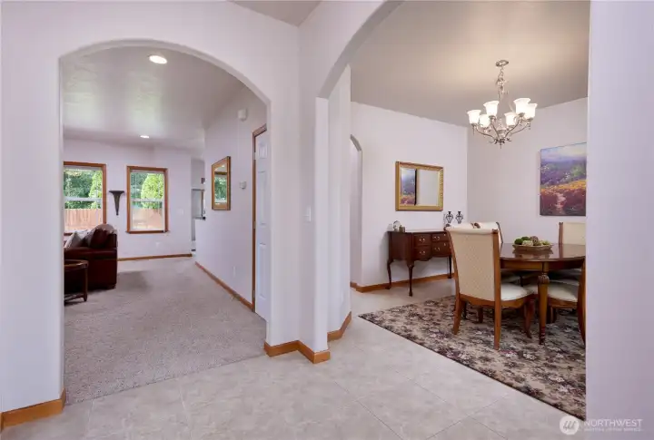 Entry leads to the main living space, den to the left and dining on the right.