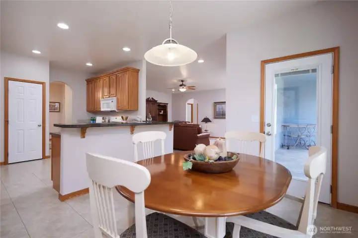 Eating space is tucked in by the window next to the patio door.