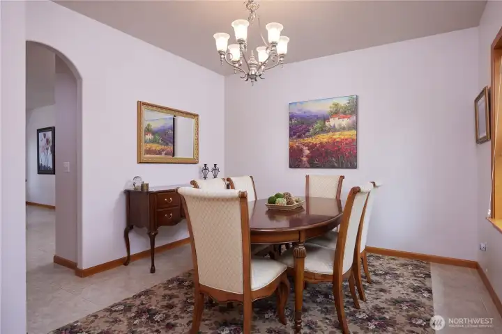 Dining room adjacent to the entry and kitchen