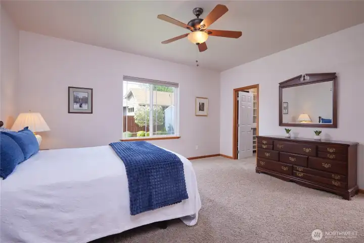 A King sixed bed and a sitting area could easily fit in the large primary bedorom.
