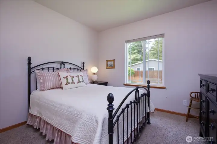 2nd bedroom on the back of the house looks into the beautiful back yard.