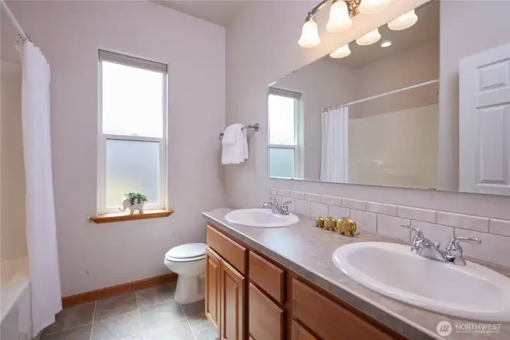 Double sinks in the hall bath between the 2nd and 3rd bedroom.