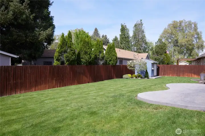 Lush and green with a good sized patio to enjoy those beautiful sunny days.
