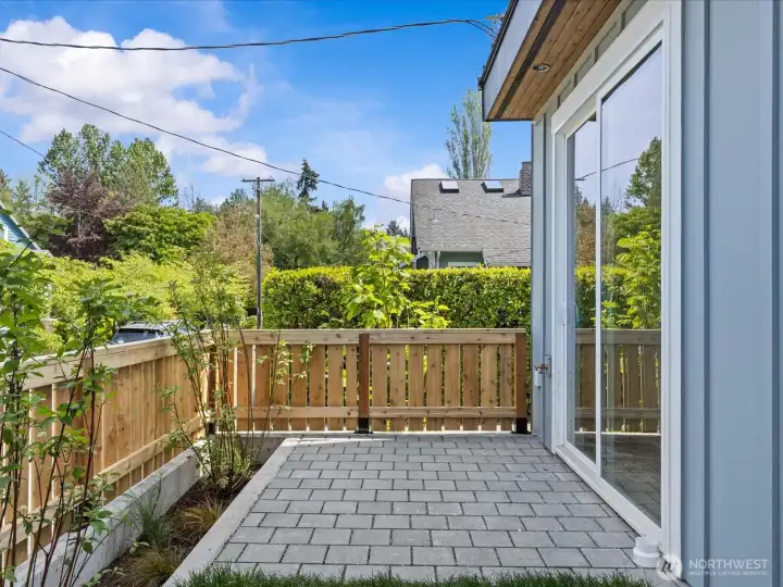 Patio and yard off living room sliders. This will be fully fence upon construction completion