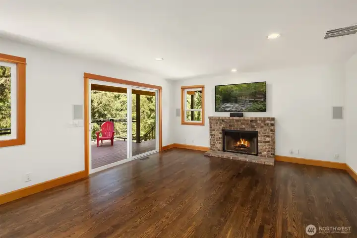 Nice size Family-room with a real wood fireplace and slider leading to the covered deck.  Great for the BBQ.
