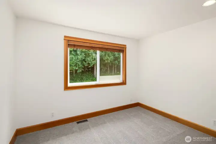 Bedroom 1 upstairs with window looking south.