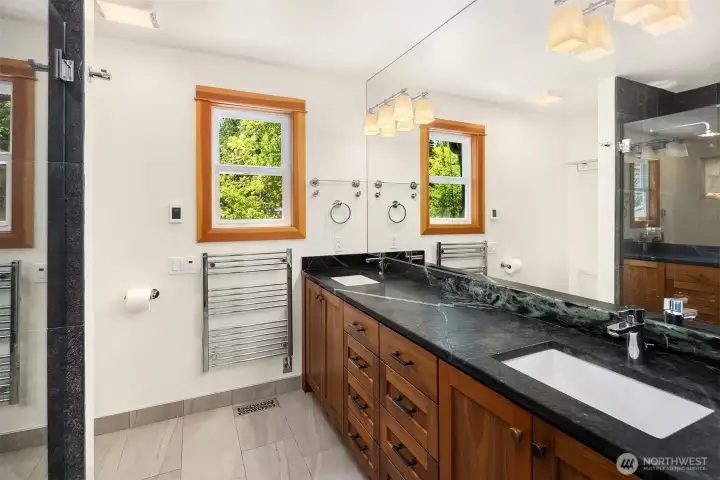 Updated primary bath with Walnut cabinets and soap-stone countertops and HEATED floors!