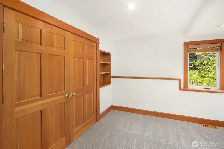 Lower-level bedroom with new carpet.