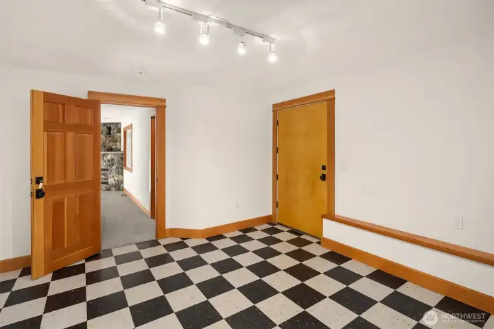 The checker room was used as a gun and fishing room in the past, but can fill many needs.