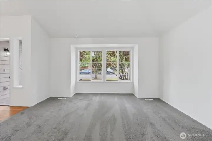 Living room with double window affords excellant natural light.