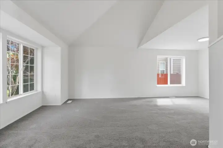 Vaulted ceilings in the living room add open aireyness.