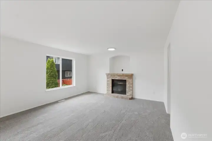 Gas fireplace with brick surround.