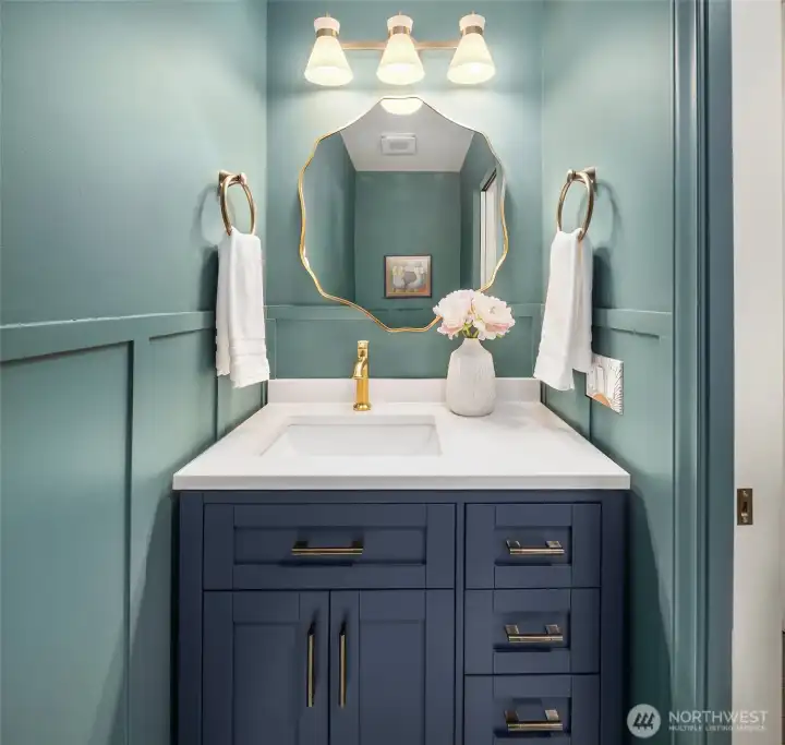 Pretty powder room on the main floor has been completely remodeled. How cute is this?