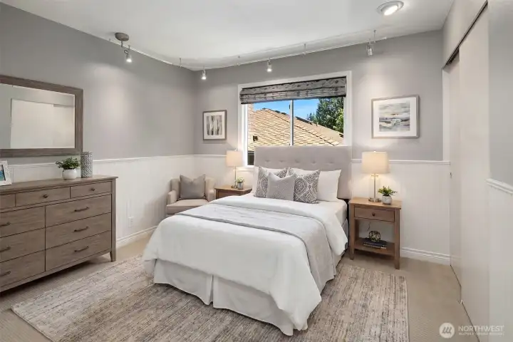 One of 4 bedrooms upstairs. This photo has been virtually staged