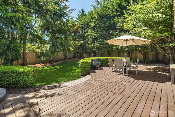 Trex decking make this a low maintenance entertaining space. Sunny backyard with mature trees, fully fenced and ready for fun!