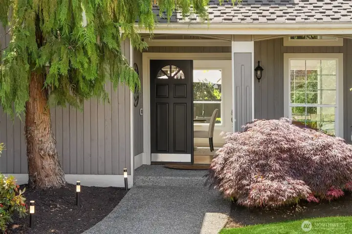 Beautifully maintained home in Harbor Heights with mature landscaping