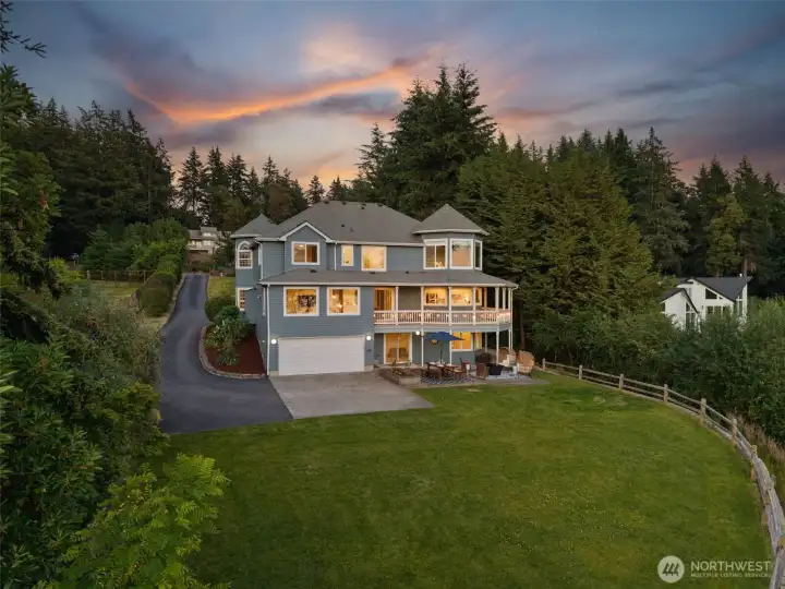 This Victorian inspired, custom built home on Fox Island truly checks all the boxes.