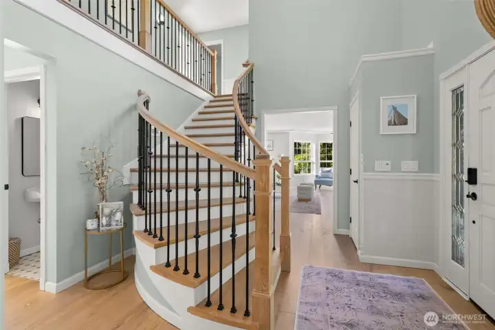Upon entering the home, you are greeted by a custom, curved staircase and beautiful 8" hardwood floors throughout most of the first and second floors.